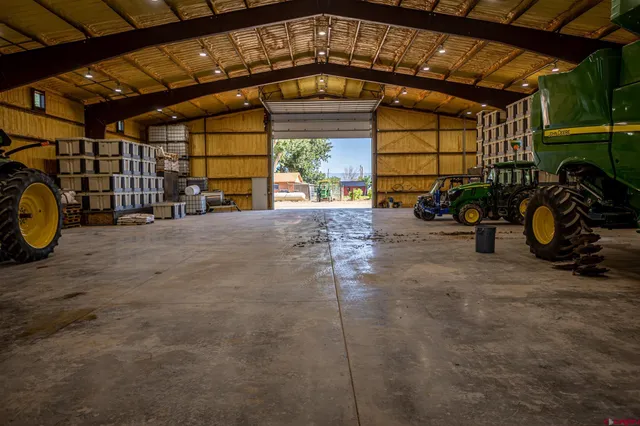 a view of a garage with a car parked in it