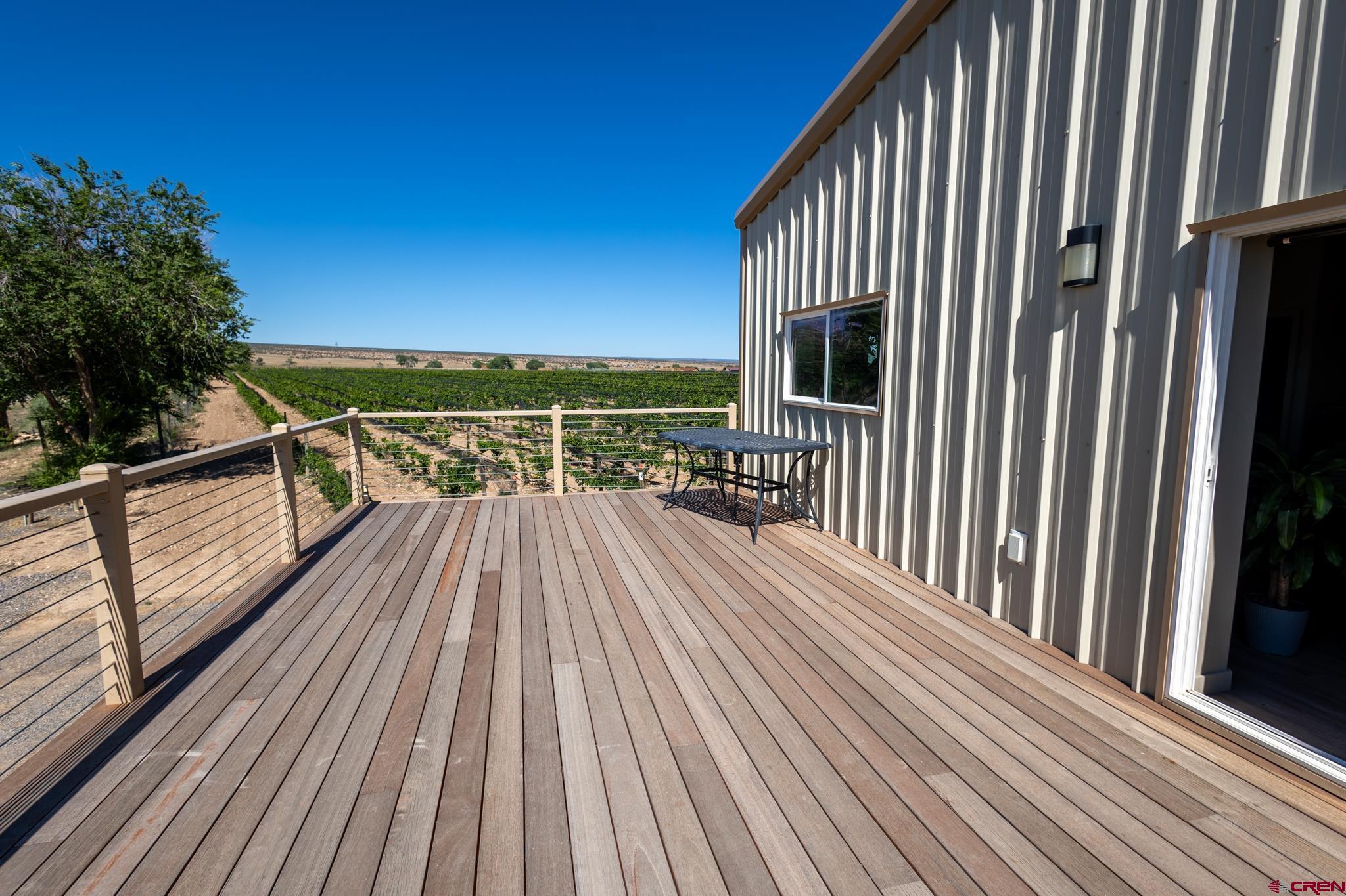 53582 Falcon Road Olathe, CO 81425 - Photo 26 of 42 a view of balcony with wooden floor and fence