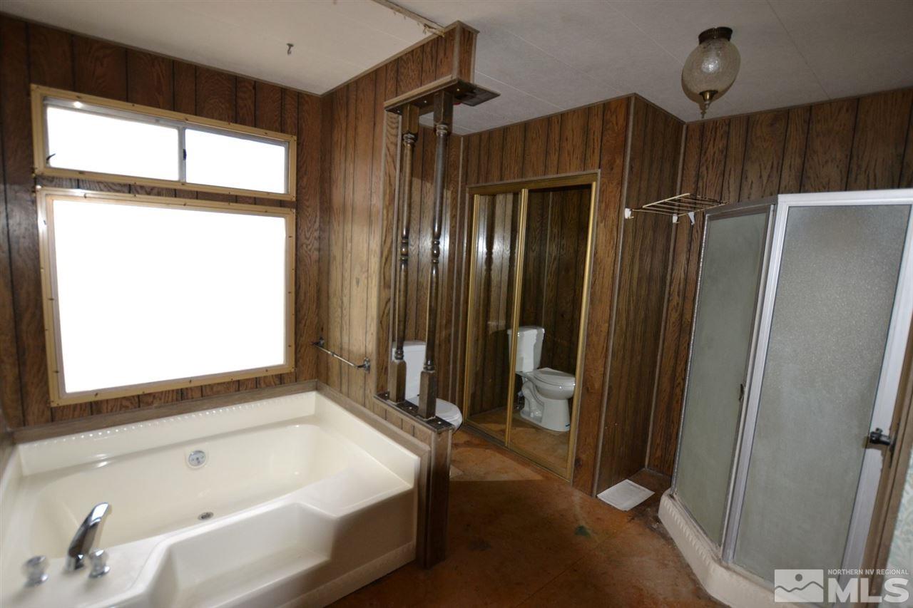 16055 Rhyolite Circle Reno, NV 89521 - Photo 19 of 23 a bathroom with a tub and a shower