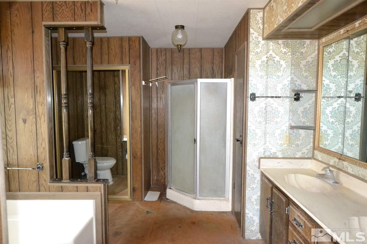 16055 Rhyolite Circle Reno, NV 89521 - Photo 20 of 23 a bathroom with a tub and a sink