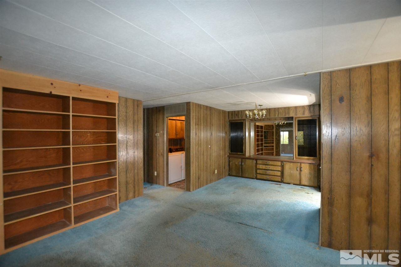 16055 Rhyolite Circle Reno, NV 89521 - Photo 8 of 23 a view of an empty room with a cabinet and mirrors