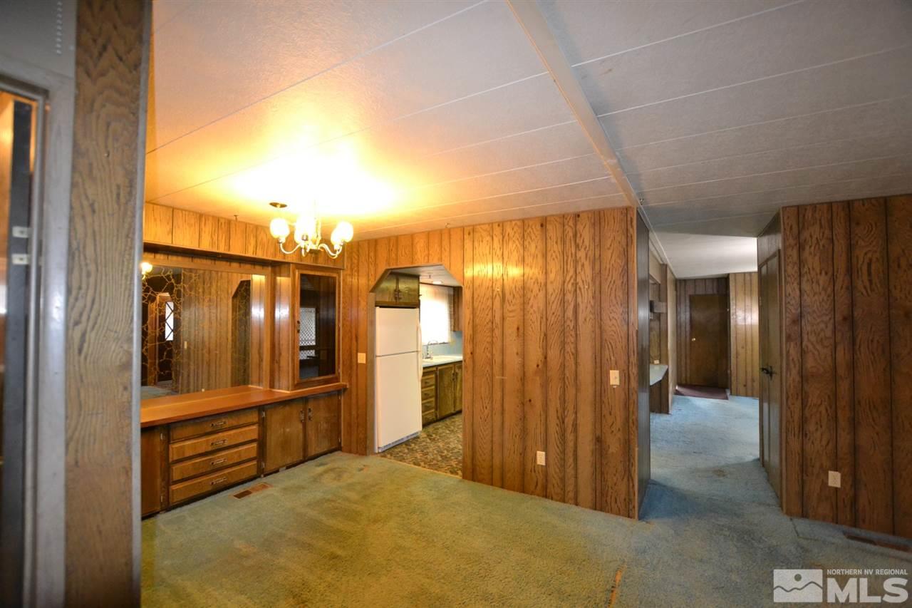 16055 Rhyolite Circle Reno, NV 89521 - Photo 9 of 23 a view of a hallway with wooden cabinets