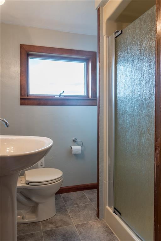 922 Agnew Road Pittsburgh, PA 15227 - Photo 14 of 19 Renovated 2nd floor bath with a walk in shower, new sink, toilet & ceramic tile floor.