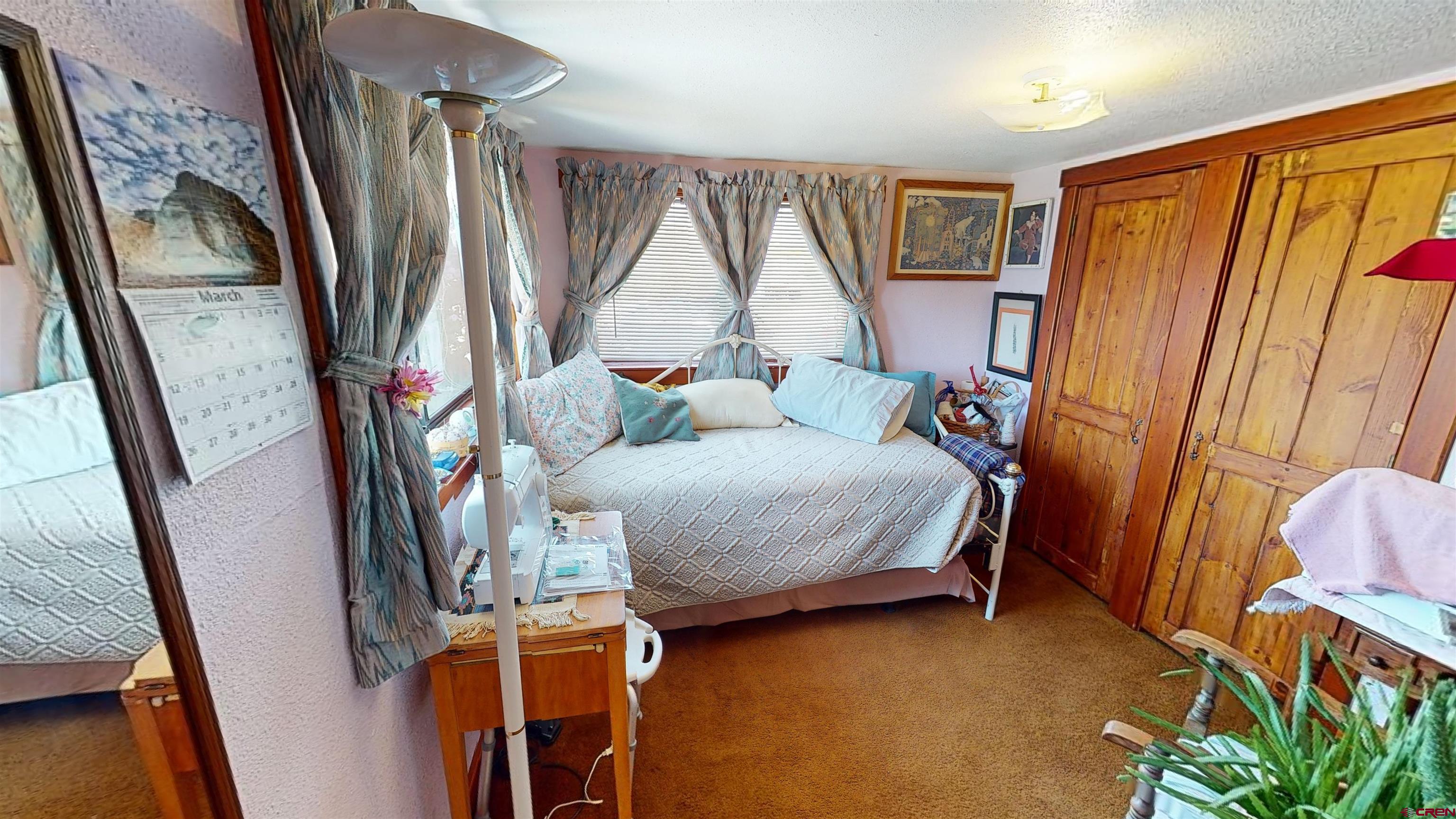 337 County Road 4018 Navajo Dam, CO 87419 - Photo 16 of 20 a bedroom with furniture and a window