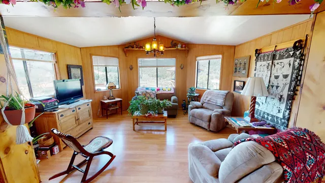 a living room with fireplace furniture and a flat screen tv
