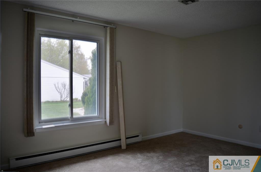 40 A Haddon Road Monroe Township, NJ 08831 - Photo 5 of 11 an empty room with a window