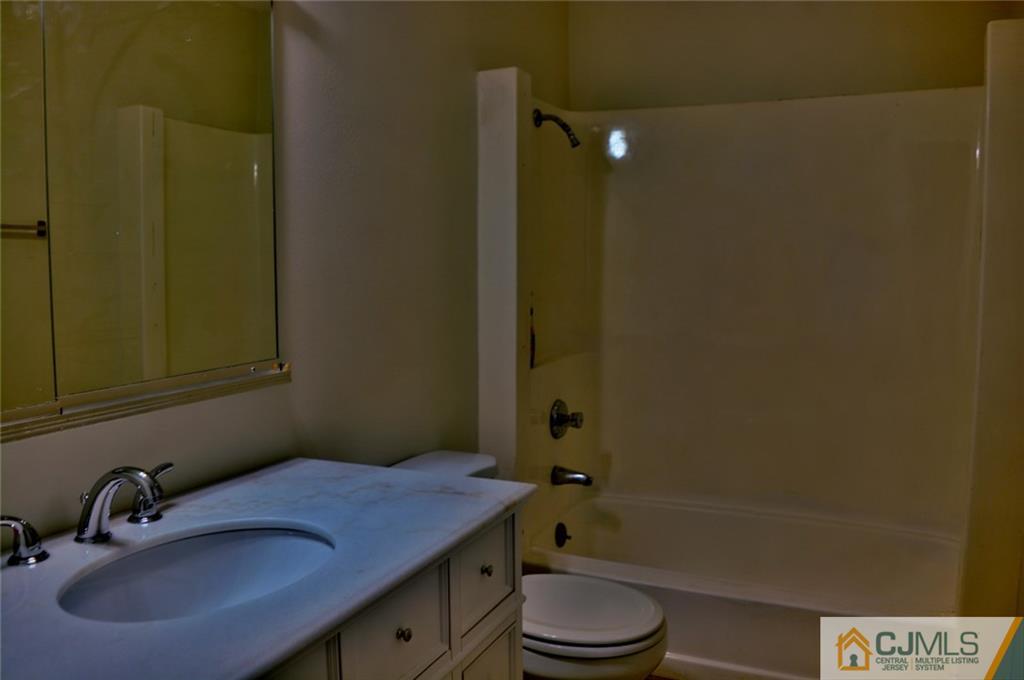 40 A Haddon Road Monroe Township, NJ 08831 - Photo 6 of 11 a bathroom with a sink a toilet and shower