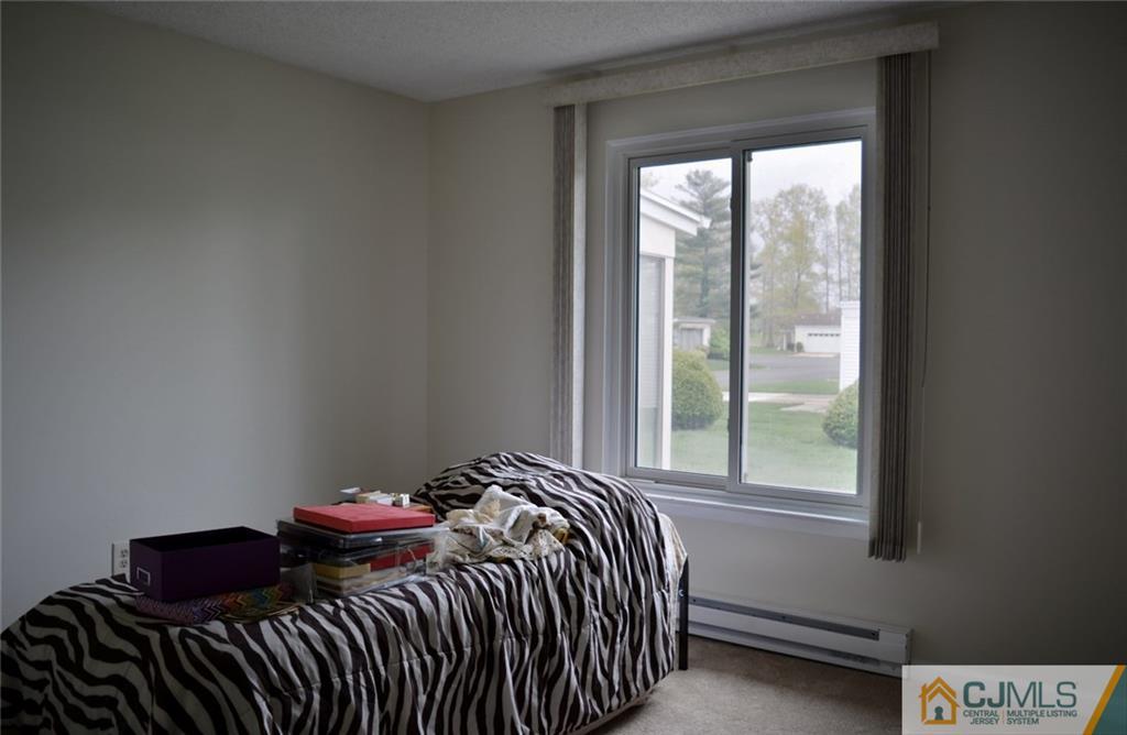 40 A Haddon Road Monroe Township, NJ 08831 - Photo 7 of 11 a bedroom with a bed and a window