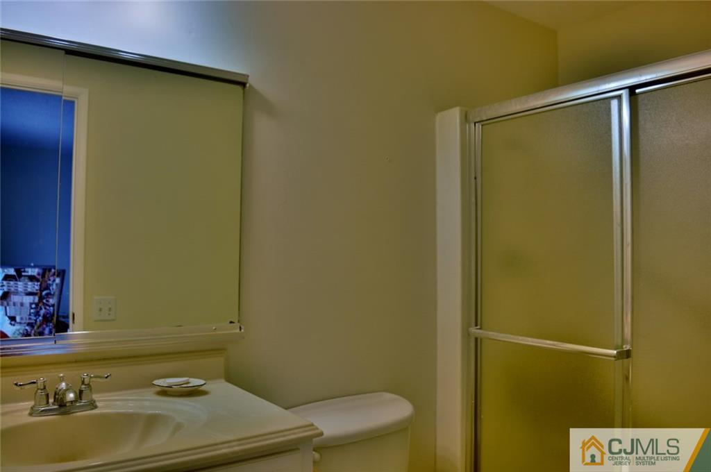 40 A Haddon Road Monroe Township, NJ 08831 - Photo 9 of 11 a bathroom with a sink and a mirror