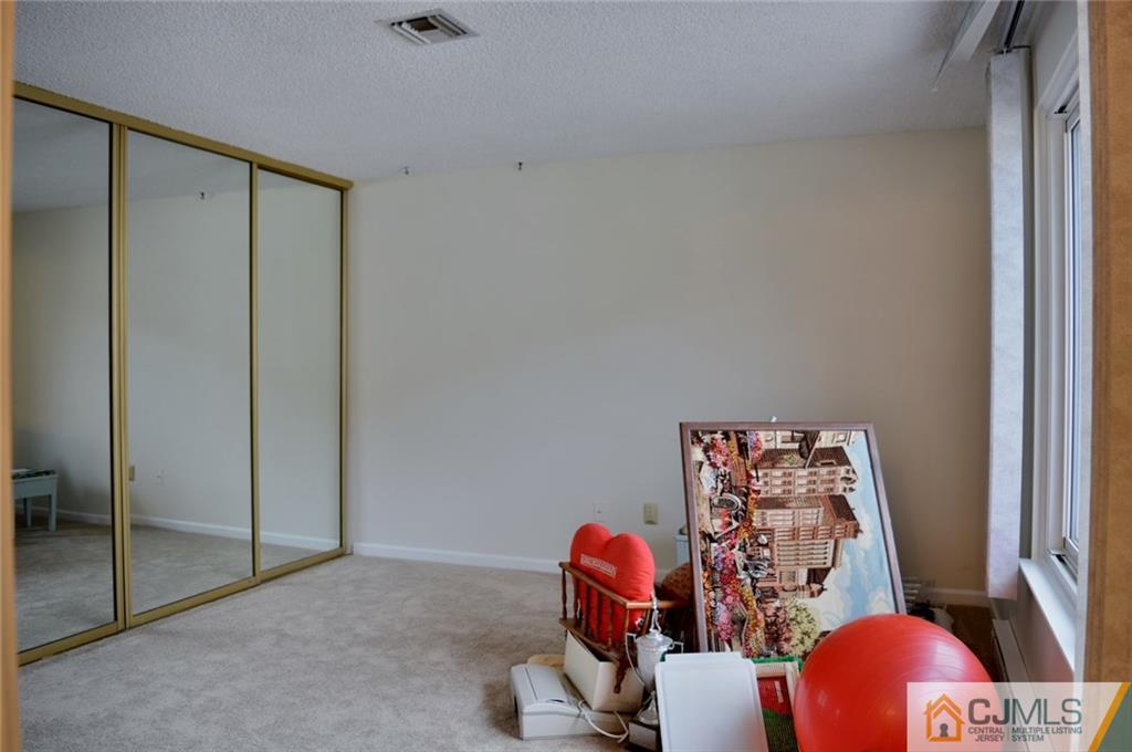 40 A Haddon Road Monroe Township, NJ 08831 - Photo 10 of 11 a view of a workspace with furniture and a window