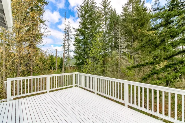 a view of balcony with wooden floor
