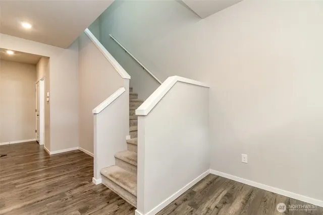 a view of entryway with wooden floor