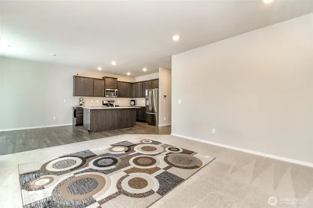 a kitchen with a stove and a refrigerator