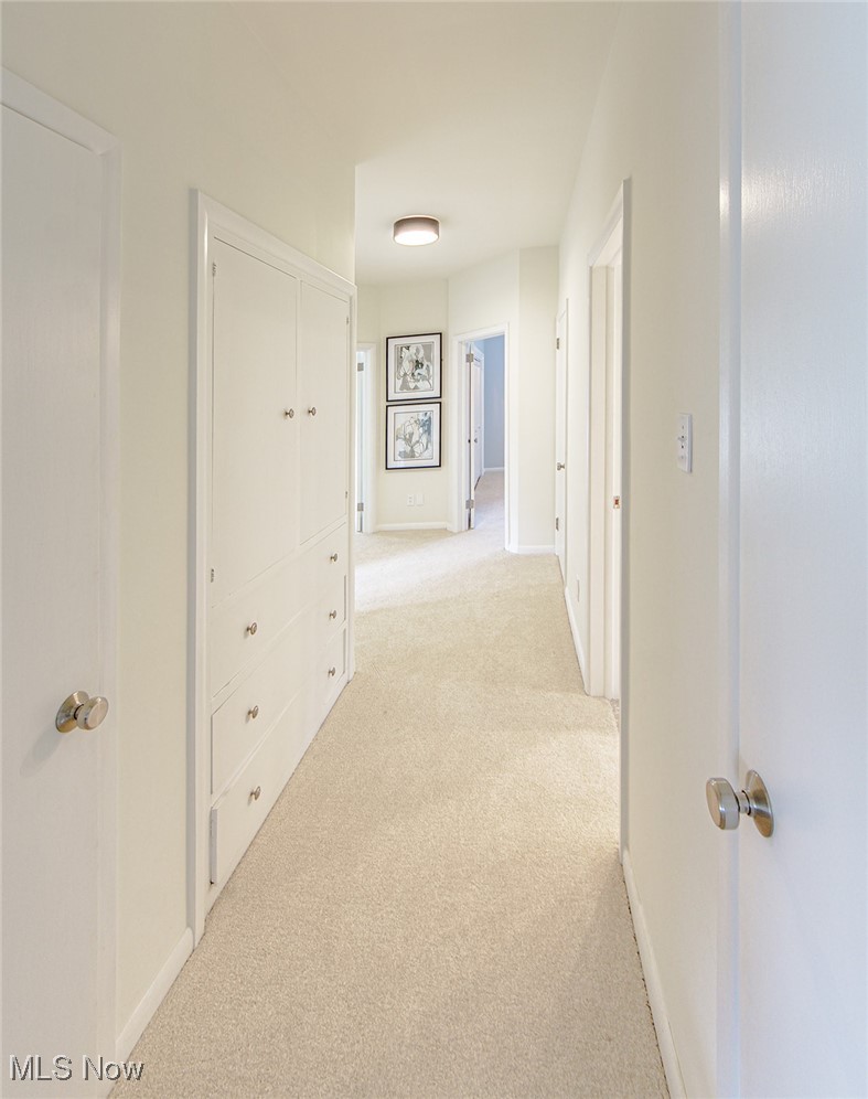 2445 Chatham Road Akron, OH 44313 - Photo 21 of 32 hallway with storage closet/drawers across from the shared full bathroom.