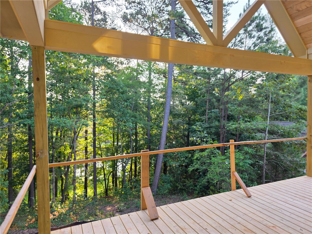 107 Abaco Lane Seneca, SC 29672 - Photo 10 of 28 Deck with scenic tree-lined and lake views, perfect for outdoor enjoyment.
