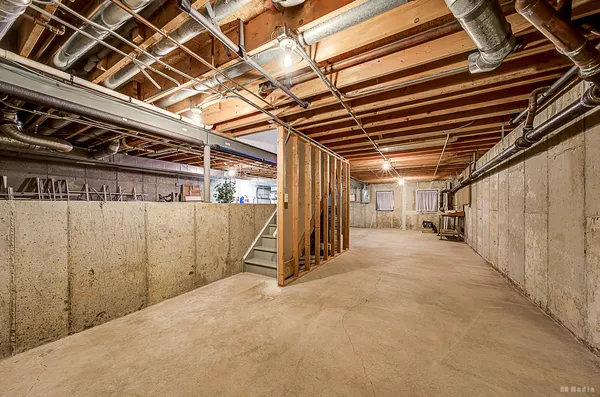 a view of a room with wooden walls
