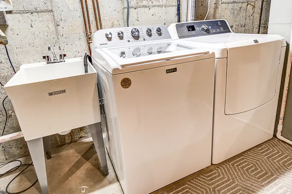 a utility room with dryer and washer