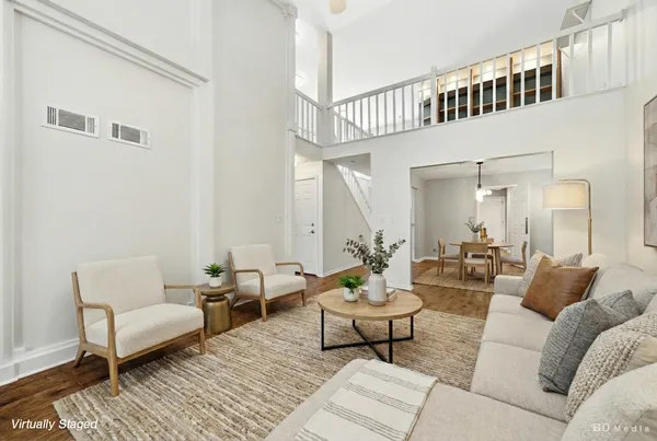 a living room with furniture and a rug