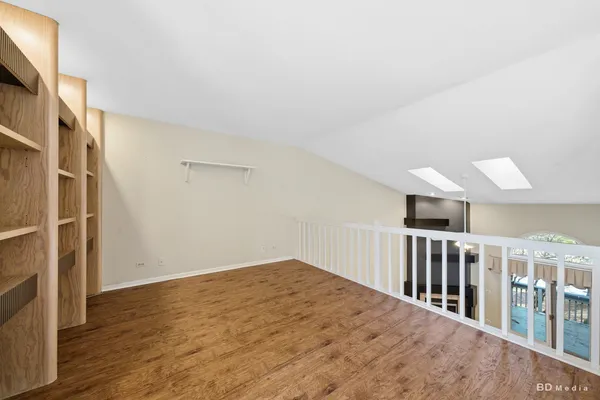 a view of staircase with lots of wooden floor