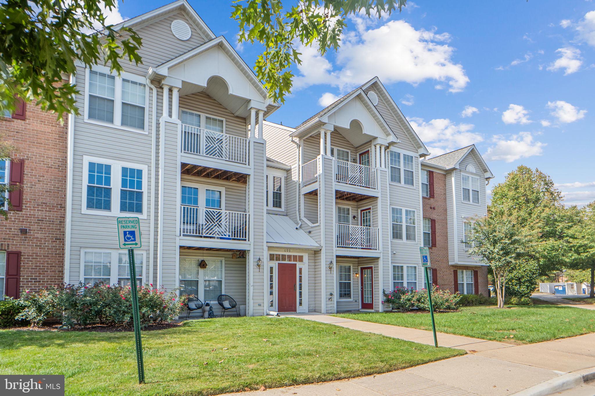 699 Winding Stream Way, Unit 203 Odenton, MD 21113 - Photo 2 of 41 a view of a building with a yard