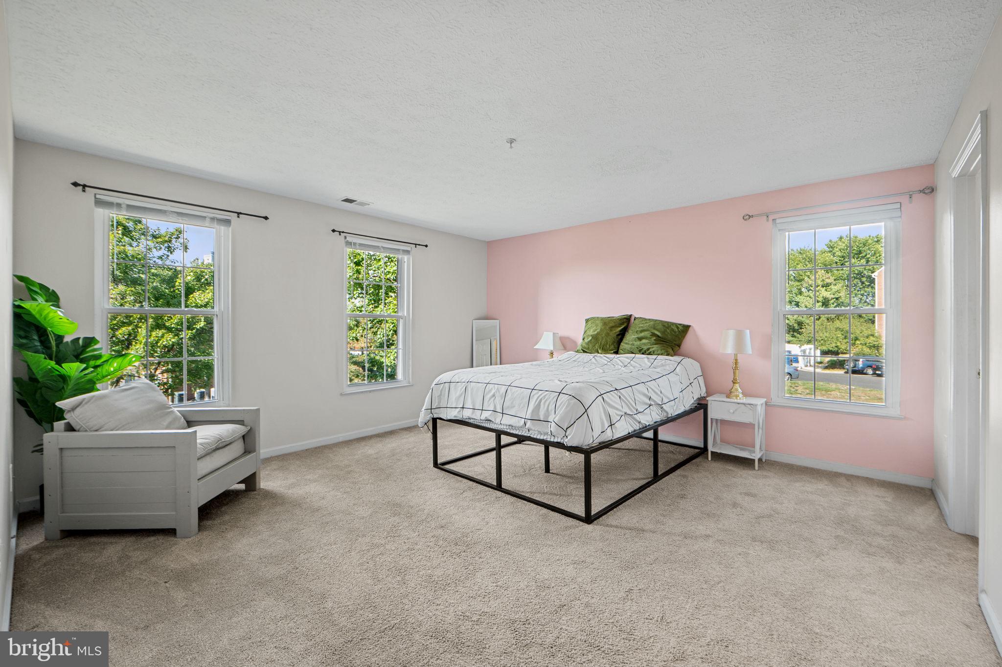 699 Winding Stream Way, Unit 203 Odenton, MD 21113 - Photo 21 of 41 a bedroom with a bed and a couch