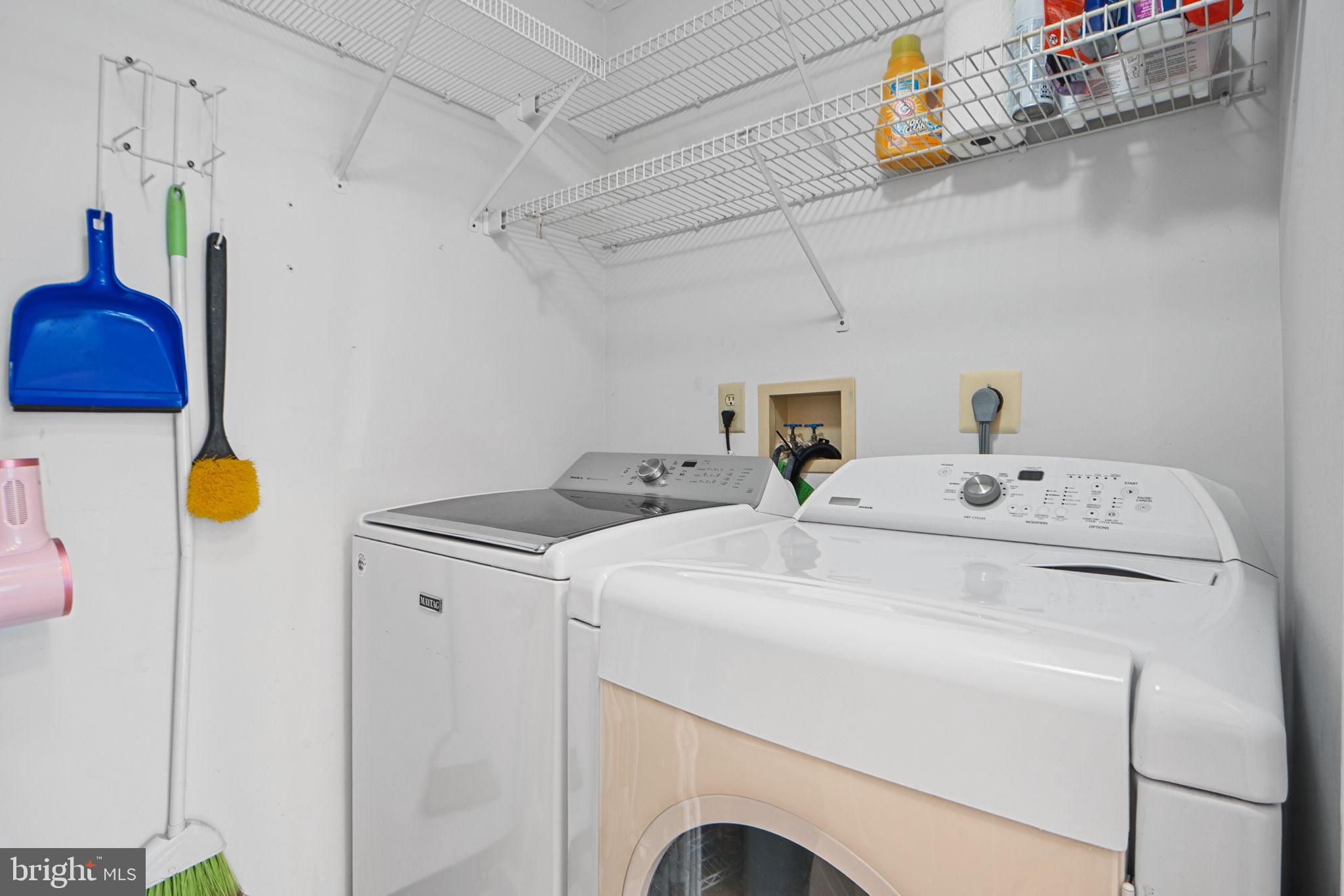 699 Winding Stream Way, Unit 203 Odenton, MD 21113 - Photo 25 of 41 a utility room with dryer and washer