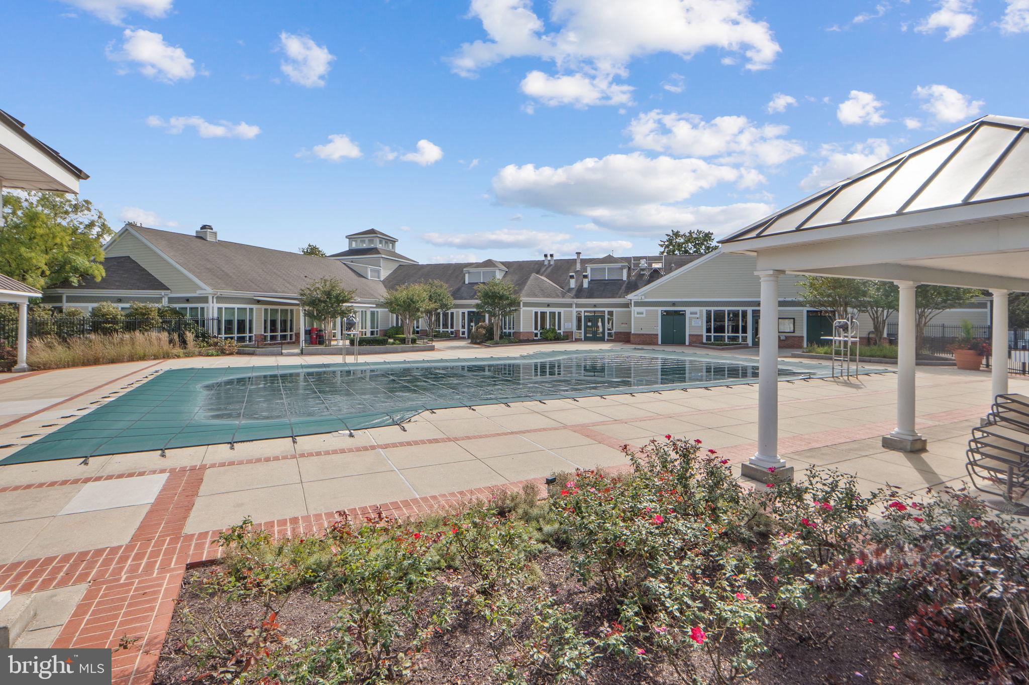 699 Winding Stream Way, Unit 203 Odenton, MD 21113 - Photo 29 of 41 a view of pool with outdoor seating