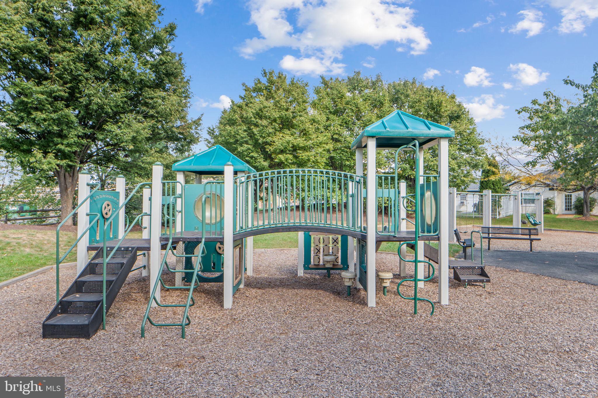 699 Winding Stream Way, Unit 203 Odenton, MD 21113 - Photo 31 of 41 a view of a house with a yard patio and furniture