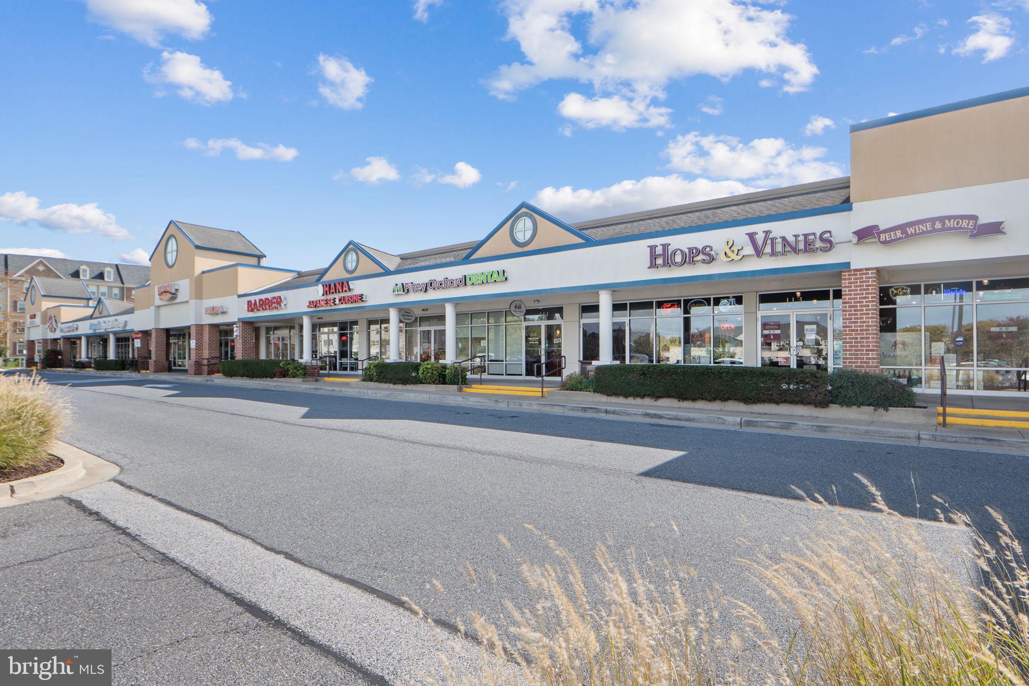 699 Winding Stream Way, Unit 203 Odenton, MD 21113 - Photo 36 of 41 a front view of a building with a garden