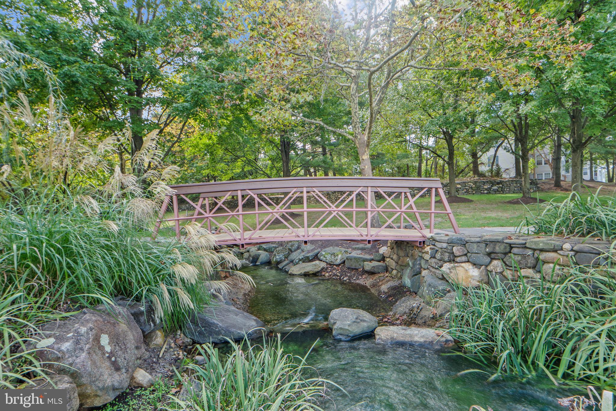 699 Winding Stream Way, Unit 203 Odenton, MD 21113 - Photo 41 of 41 a view of a wooden house with large trees