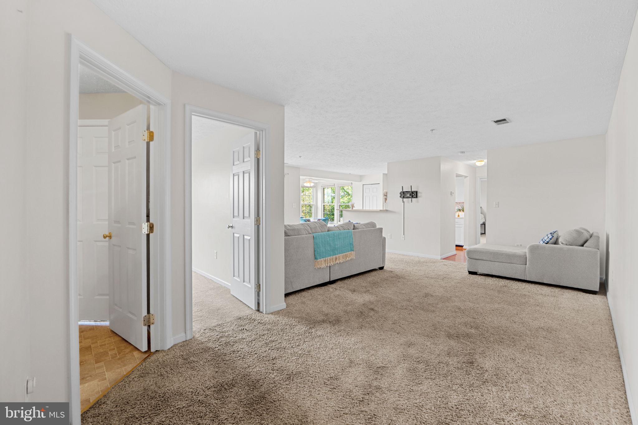 699 Winding Stream Way, Unit 203 Odenton, MD 21113 - Photo 5 of 41 a view of a livingroom with furniture and cabinet
