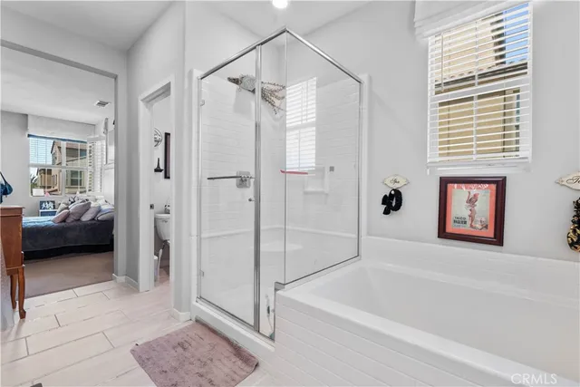 a bathroom with a tub shower and a sink