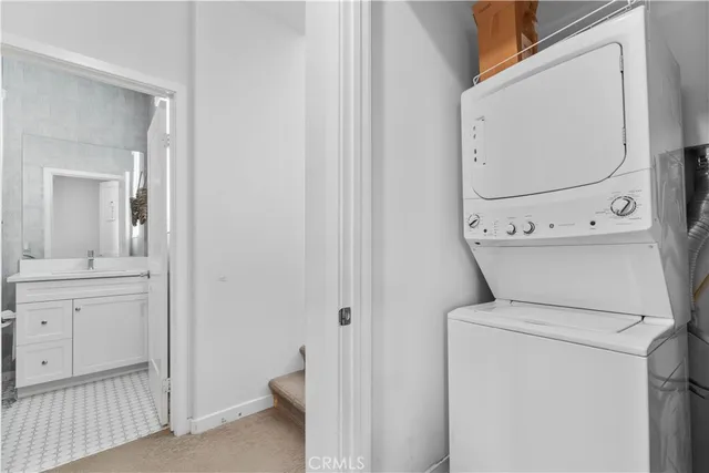 a view of bathroom with a toilet a sink and a mirror