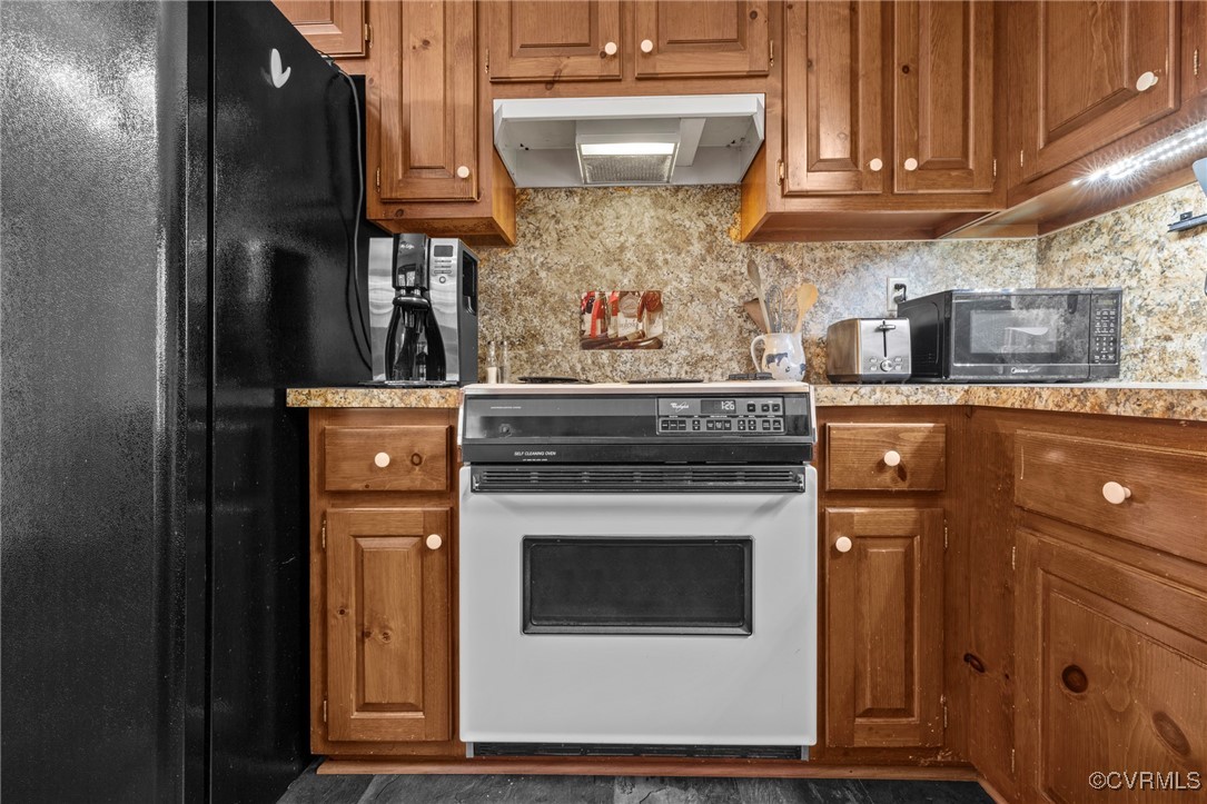 6137 Dijon Drive Mechanicsville, VA 23111 - Photo 13 of 44 a kitchen with stainless steel appliances granite countertop a stove and a refrigerator