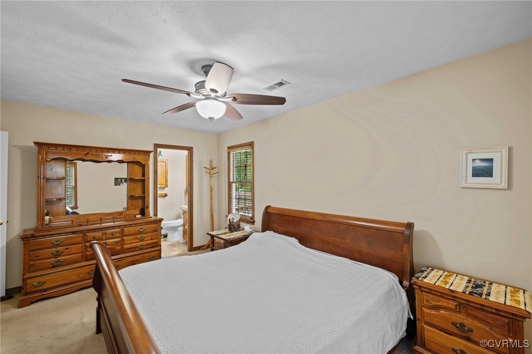 6137 Dijon Drive Mechanicsville, VA 23111 - Photo 17 of 44 a bedroom with a bed and wooden floor