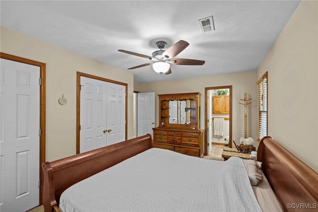 6137 Dijon Drive Mechanicsville, VA 23111 - Photo 18 of 44 a bedroom with a large bed and two large window