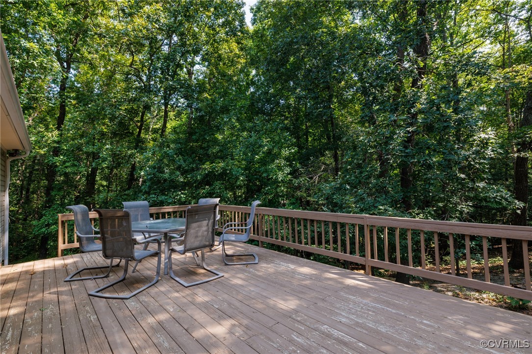6137 Dijon Drive Mechanicsville, VA 23111 - Photo 34 of 44 a view of a two chairs and table on the wooden floor