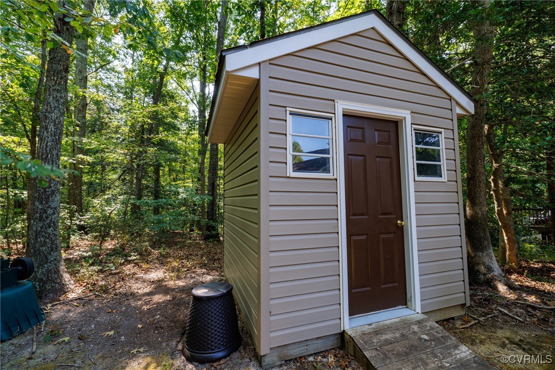 6137 Dijon Drive Mechanicsville, VA 23111 - Photo 36 of 44 a view of a small house and a yard