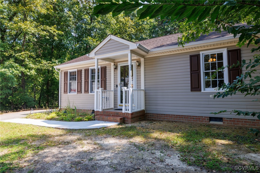 6137 Dijon Drive Mechanicsville, VA 23111 - Photo 5 of 44 a front view of a house with a yard