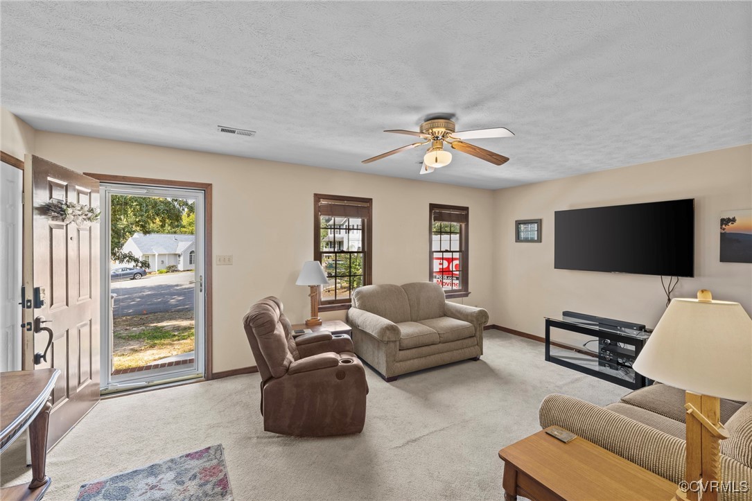 6137 Dijon Drive Mechanicsville, VA 23111 - Photo 6 of 44 a living room with furniture and a flat screen tv