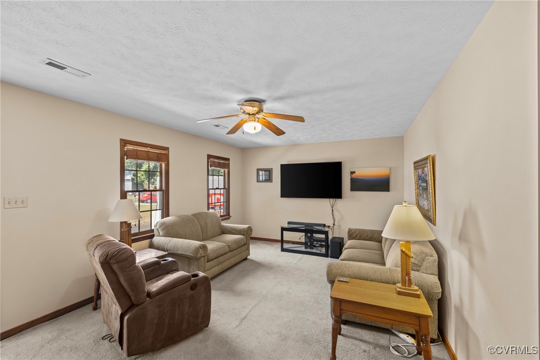 6137 Dijon Drive Mechanicsville, VA 23111 - Photo 8 of 44 a living room with furniture and a flat screen tv