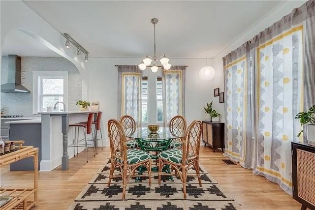 3353 Myrtle Street Hapeville, GA 30354 - Photo 4 of 22 a view of a dining room with furniture and chandelier