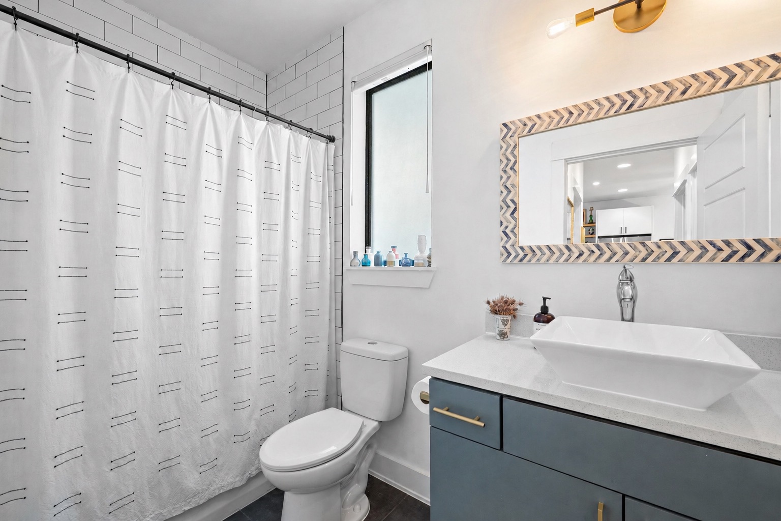 4615 Depew Avenue Austin, TX 78751 - Photo 27 of 40 Full bathroom downstairs attached to bedroom
