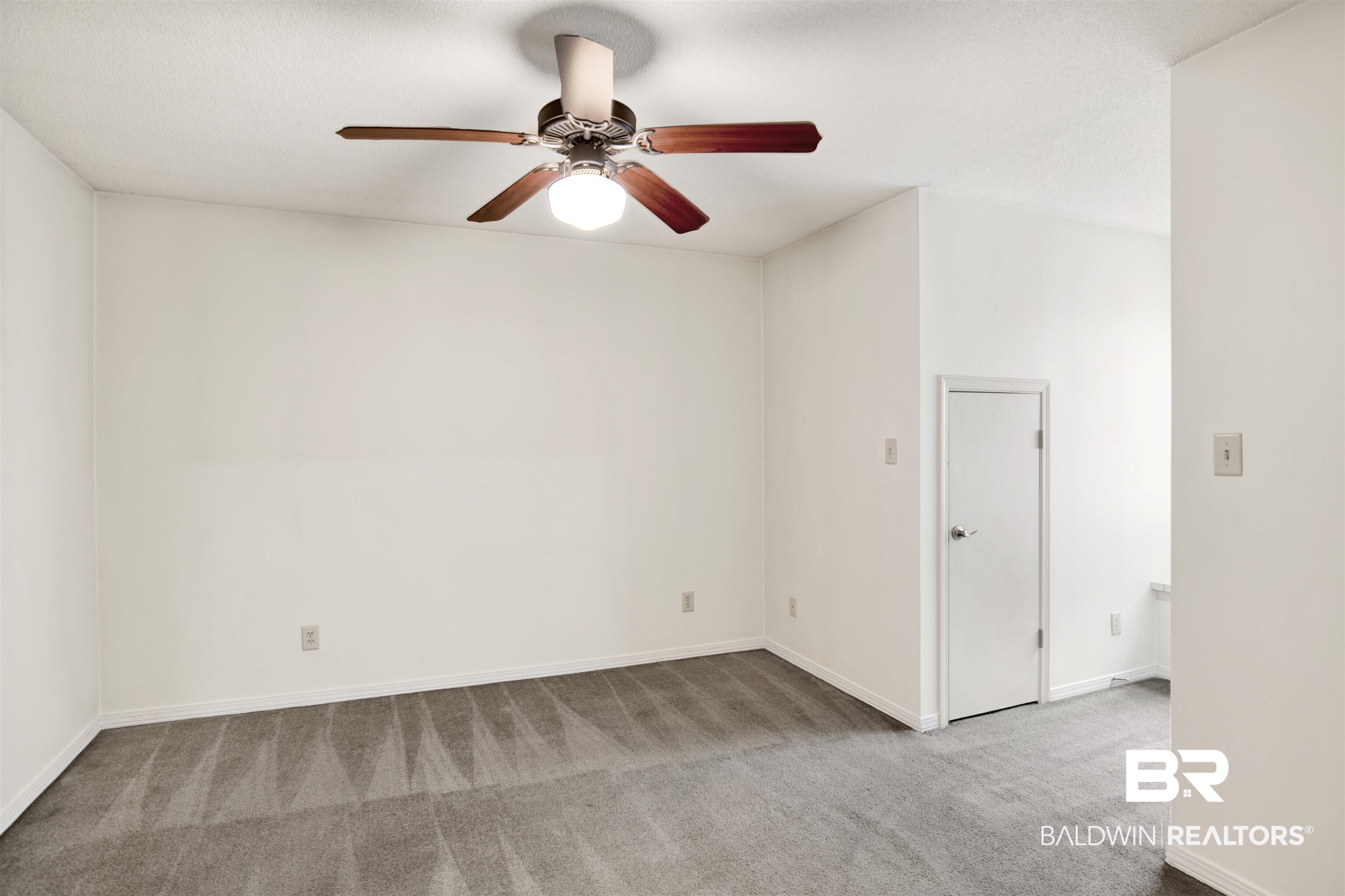 3412 Peyton Court Mobile, AL 36695 - Photo 22 of 27 Spare room featuring carpet, a ceiling fan, and baseboards