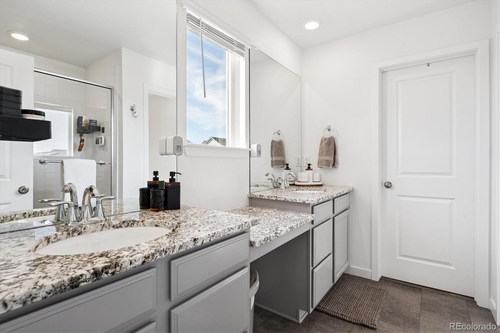 3530 Sawtooth Street Frederick, CO 80516 - Photo 17 of 36 a bathroom with a sink and a mirror