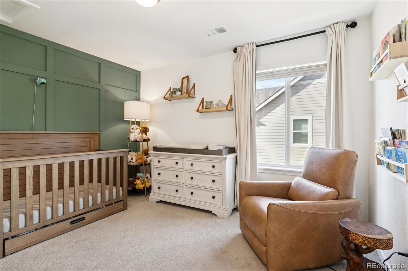 3530 Sawtooth Street Frederick, CO 80516 - Photo 19 of 36 a bedroom with furniture and a window