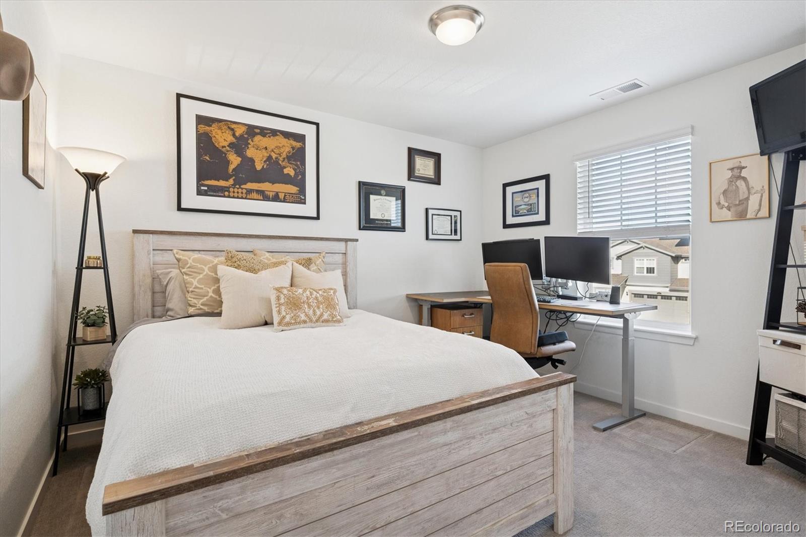3530 Sawtooth Street Frederick, CO 80516 - Photo 20 of 36 a bedroom with a bed and a desk