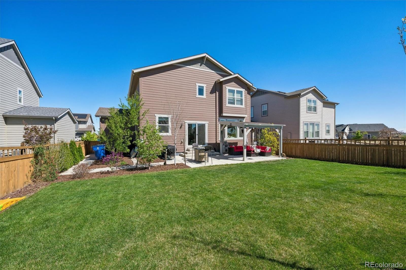 3530 Sawtooth Street Frederick, CO 80516 - Photo 26 of 36 a front view of house with yard and outdoor seating