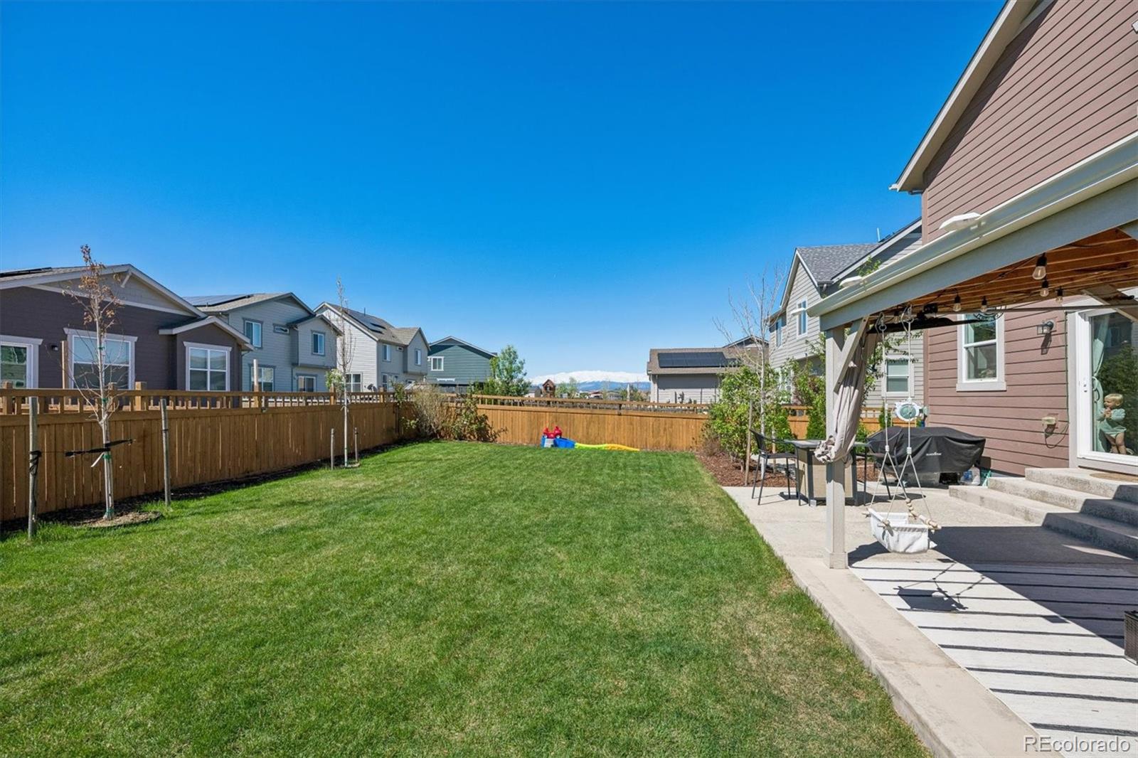 3530 Sawtooth Street Frederick, CO 80516 - Photo 27 of 36 a view of a house with a yard and sitting area