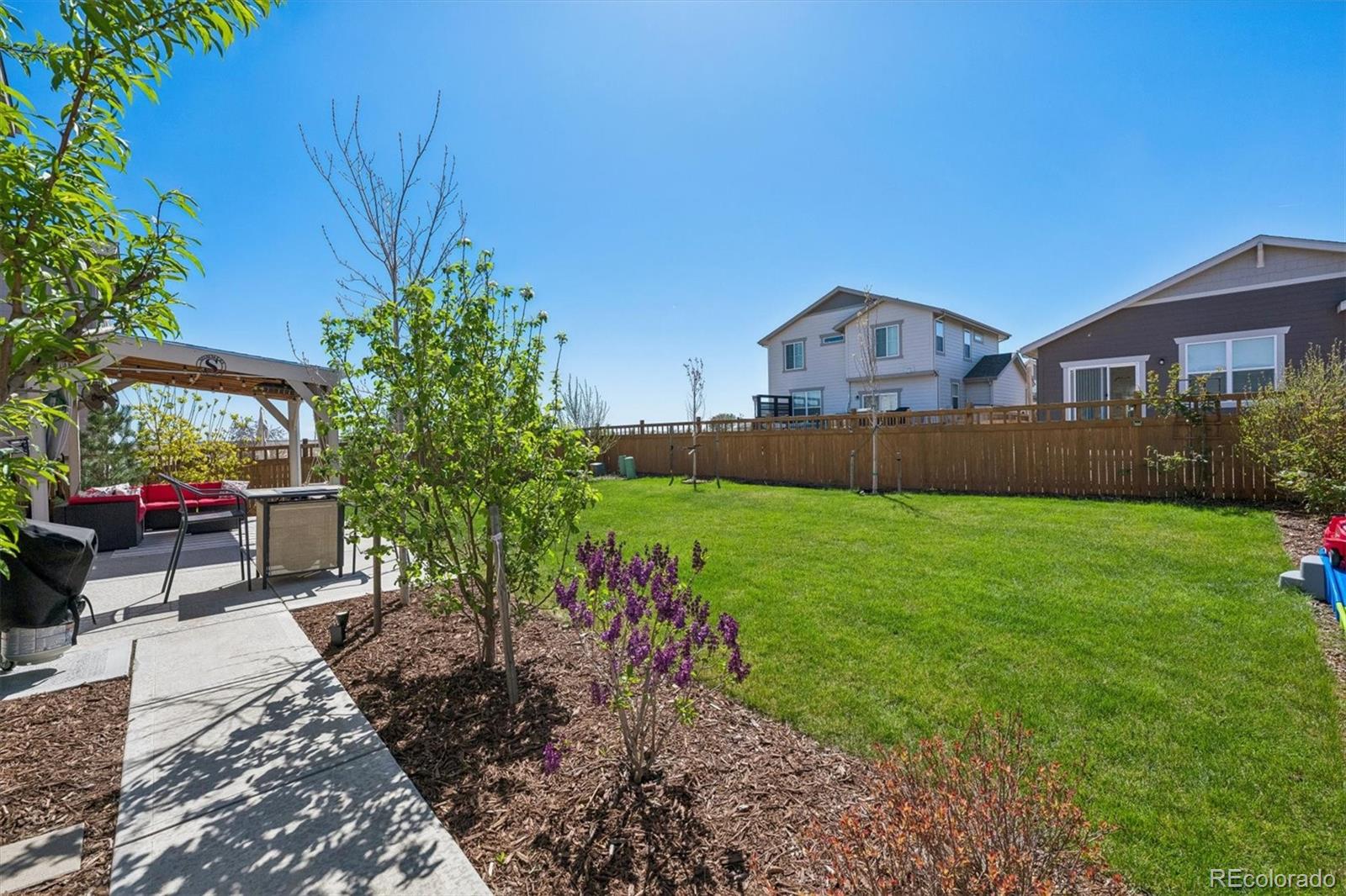 3530 Sawtooth Street Frederick, CO 80516 - Photo 28 of 36 a front view of a house with a yard